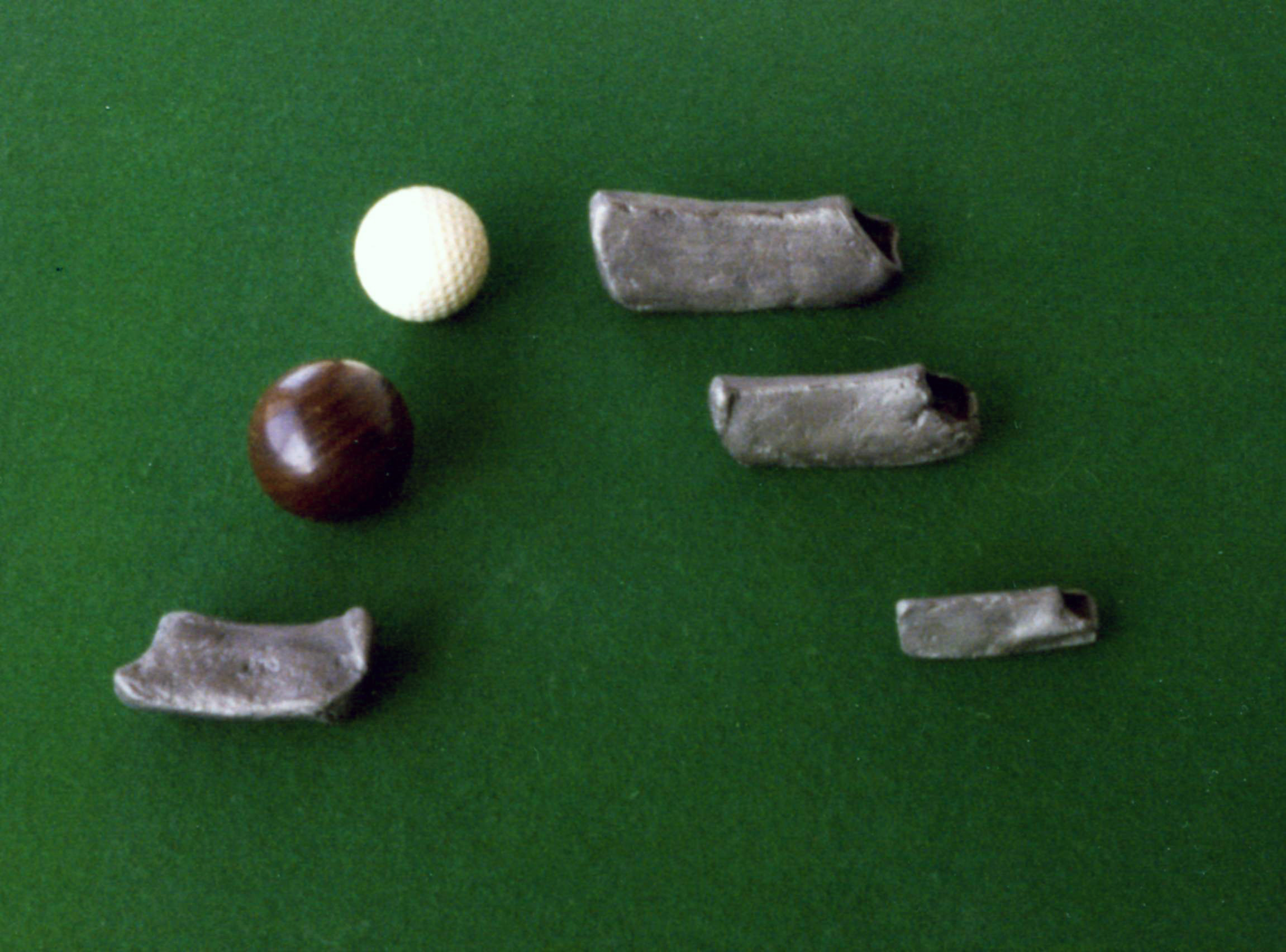 Heads of Dutch Colf Clubs and a wooden Colf Ball