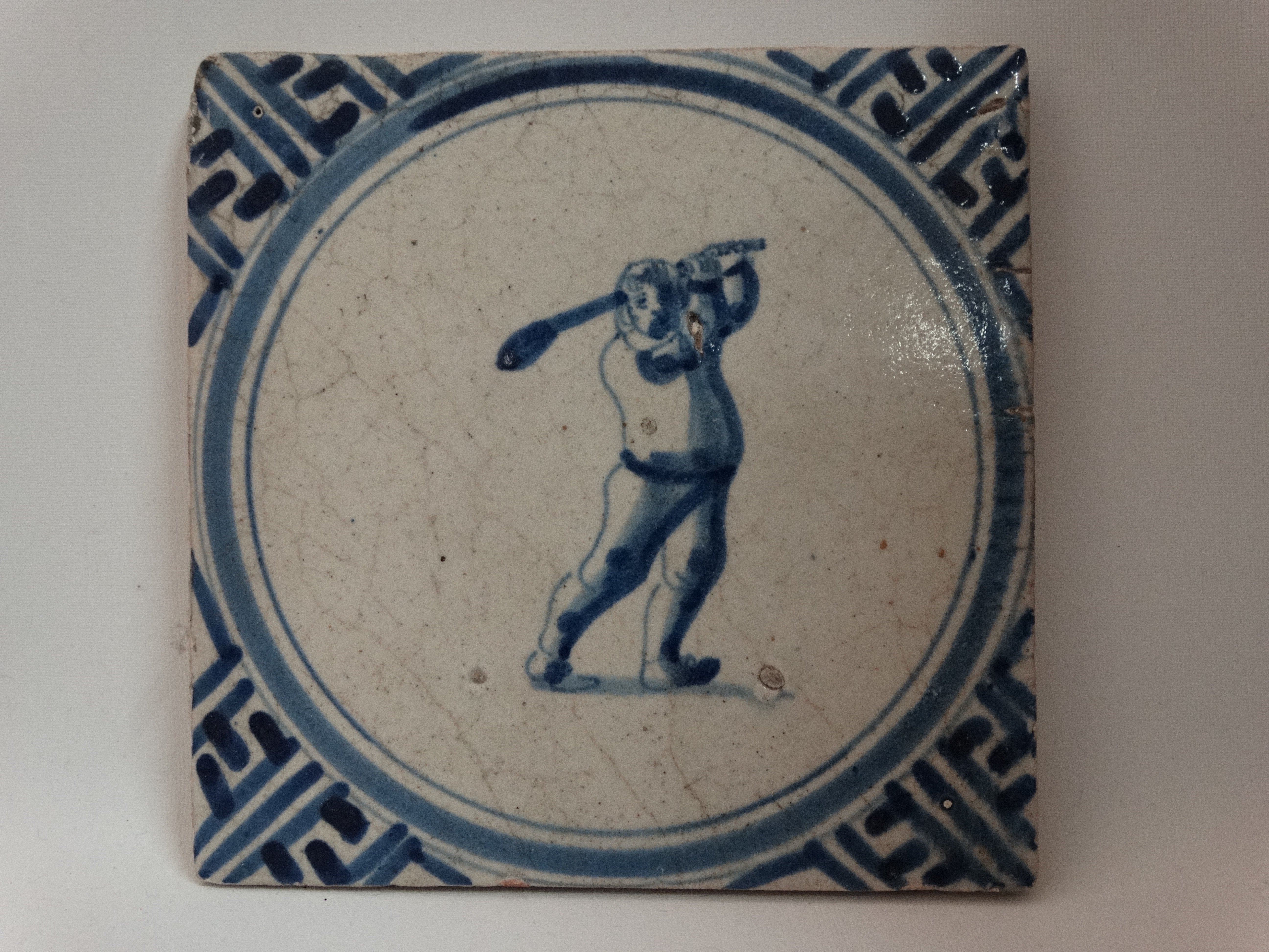 Wandtegel, groep 1B, Wan-Li rand, colver die een full swing probeert